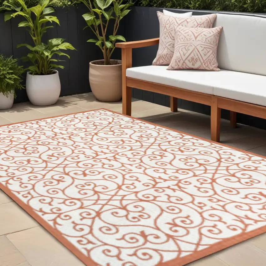 Cream And Orange Geometric Indoor Outdoor Area Rug Photo 1