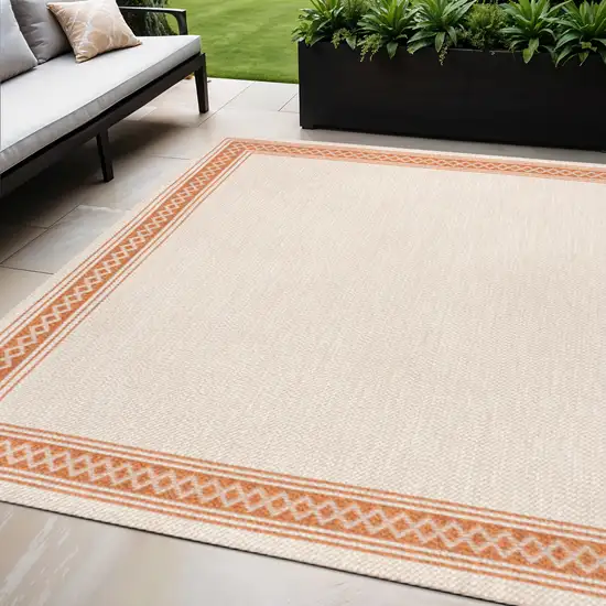 Cream And Orange Indoor Outdoor Area Rug Photo 1