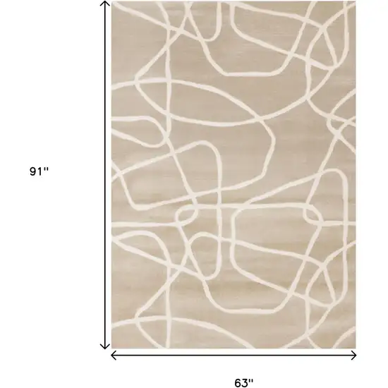 Cream And Tan Abstract Area Rug Photo 3