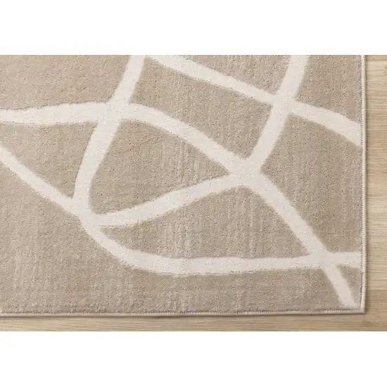 Cream And Tan Abstract Area Rug Photo 9