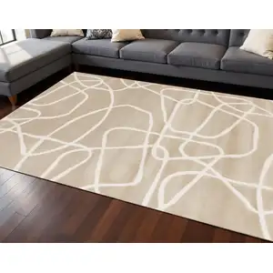 Photo of Cream And Tan Abstract Area Rug