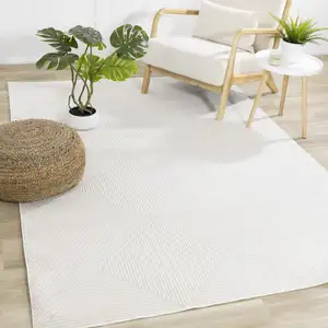 Photo of Cream And White Geometric Area Rug
