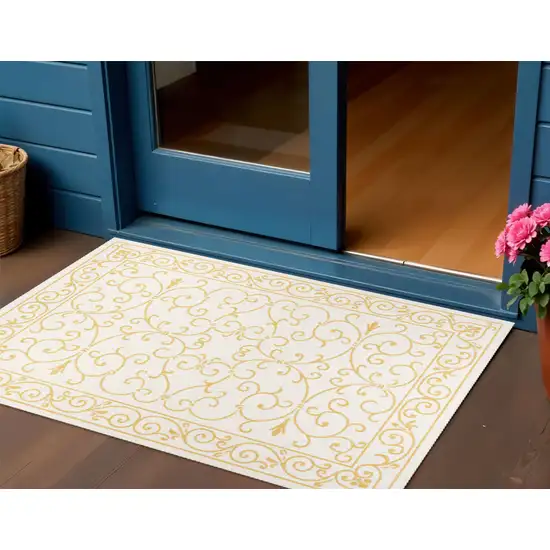 Cream And Yellow Medallion Indoor Outdoor Area Rug Photo 1
