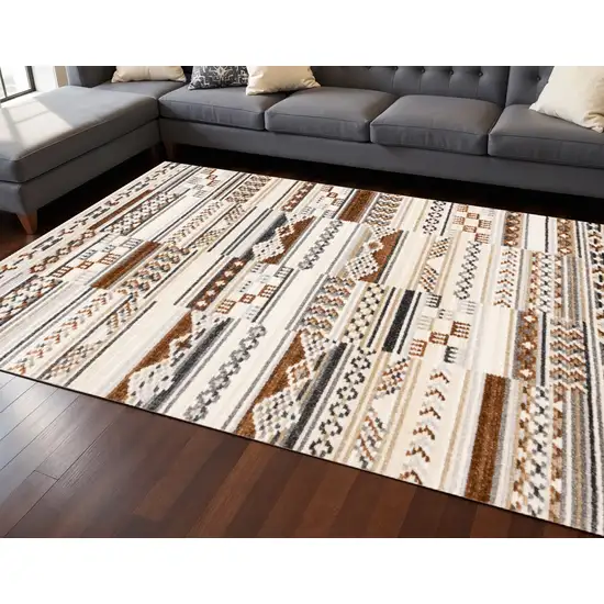 Cream Black And Brown Tribal Area Rug Photo 1