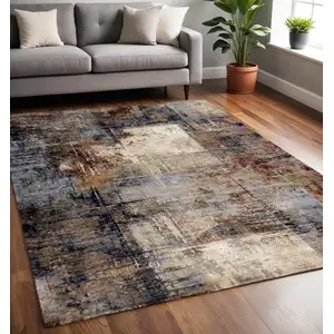 Photo of Cream Black And Tan Abstract Area Rug