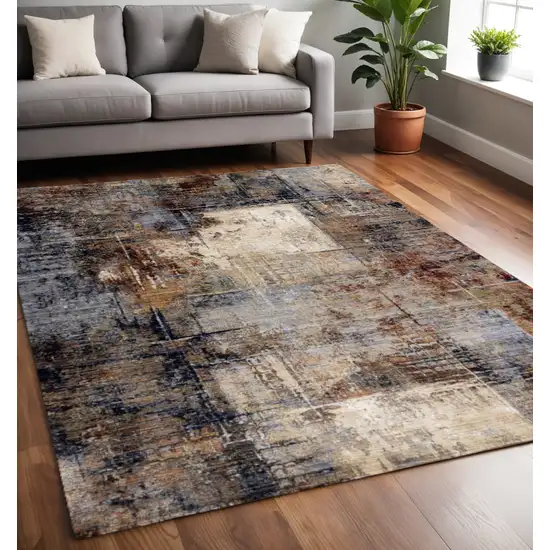 Cream Black And Tan Abstract Area Rug Photo 1