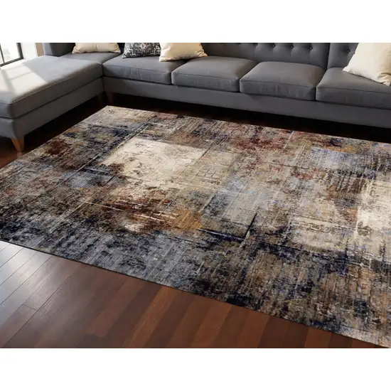 Cream Black And Tan Abstract Area Rug Photo 1