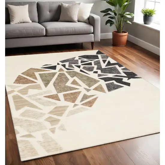 Cream Black And Tan Abstract Area Rug Photo 1