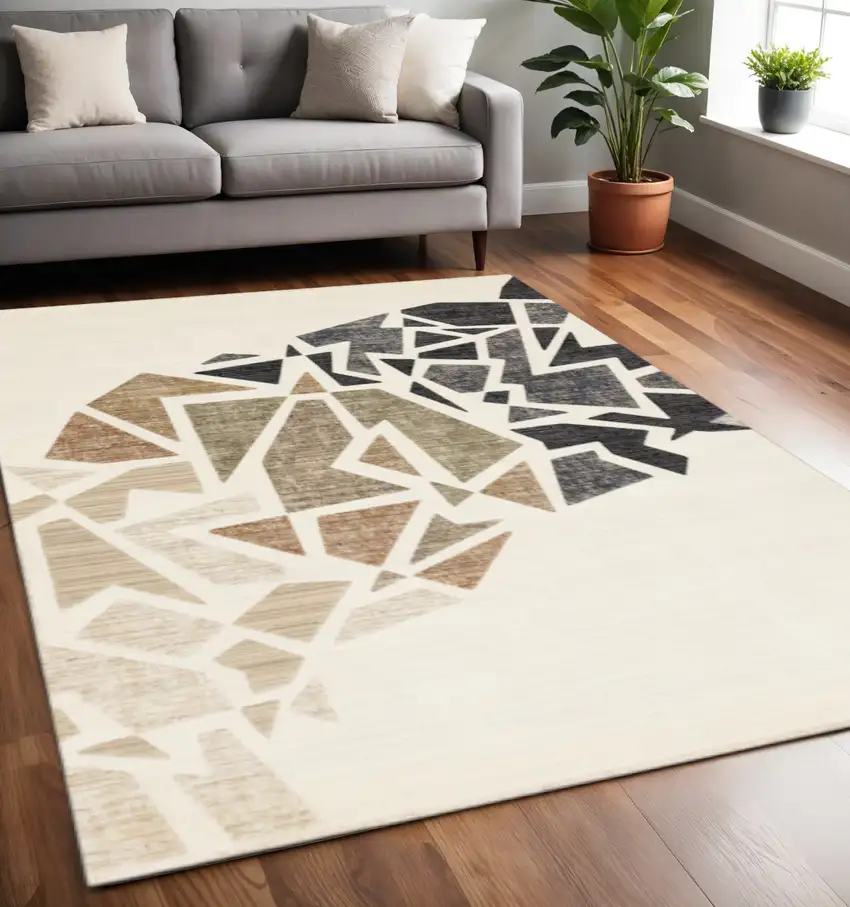 Cream Black And Tan Abstract Area Rug Photo 1