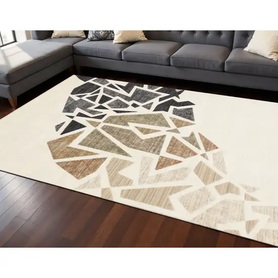 Cream Black And Tan Abstract Area Rug Photo 1