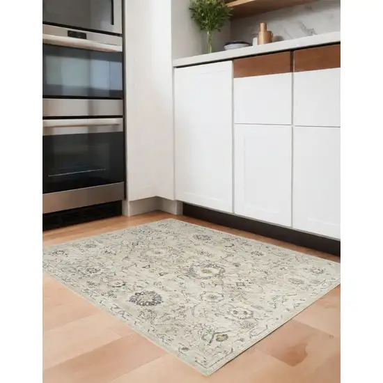 Cream Black And Yellow Floral Distressed Area Rug Photo 1