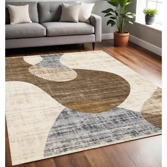 Cream Blue And Brown Abstract Area Rug Photo 1