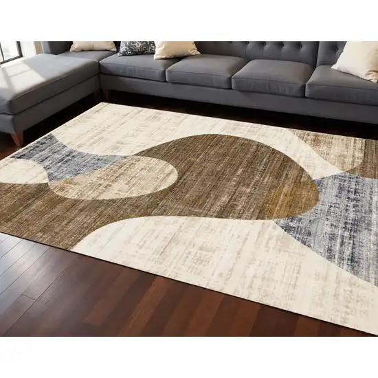 Cream Blue And Brown Abstract Area Rug Photo 1