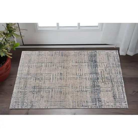 Cream Blue And Ivory Geometric Distressed Stain Resistant Area Rug Photo 1