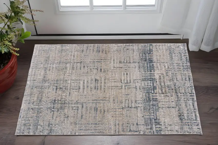 Cream Blue And Ivory Geometric Distressed Stain Resistant Area Rug Photo 1