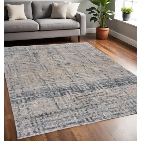 Cream Blue And Ivory Geometric Distressed Stain Resistant Area Rug Photo 1