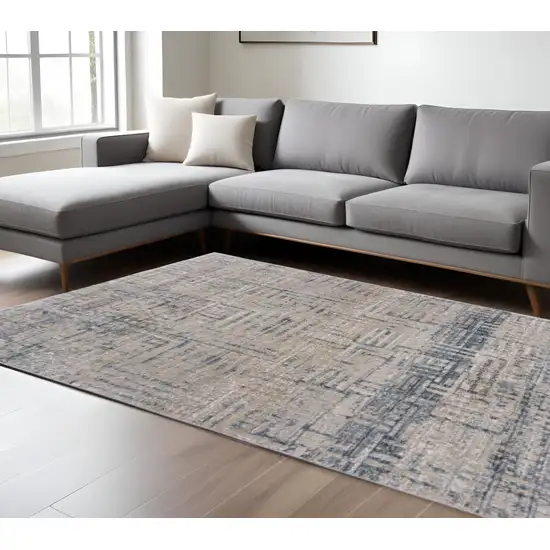 Cream Blue And Ivory Geometric Distressed Stain Resistant Area Rug Photo 1