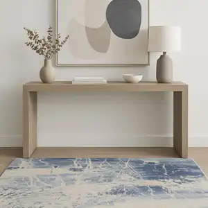 Photo of Cream Blue And Light Blue Abstract Area Rug