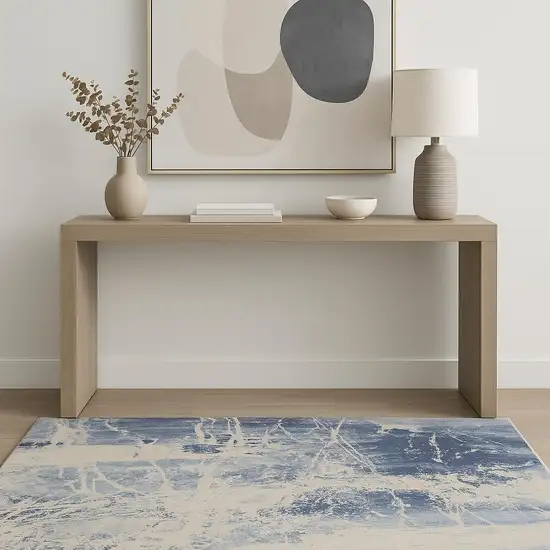 Cream Blue And Light Blue Abstract Area Rug Photo 1