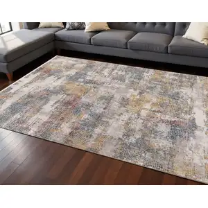 Photo of Cream Blue And Yellow Abstract Area Rug