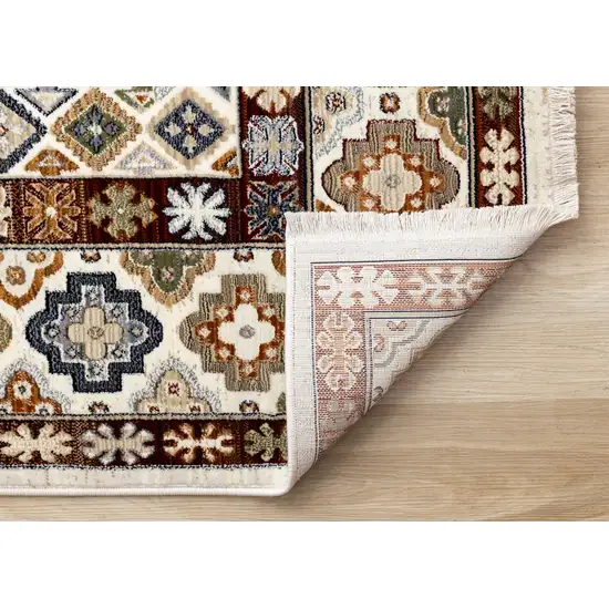 Cream Brown And Tan Oriental Area Rug Photo 9