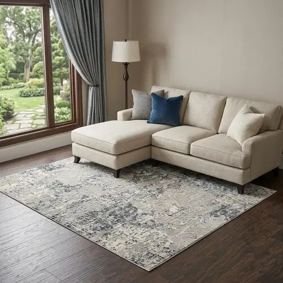 Cream Gray And Beige Abstract Area Rug Photo 1
