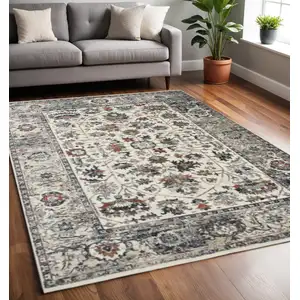 Photo of Cream Gray And Red Floral Medallion Area Rug