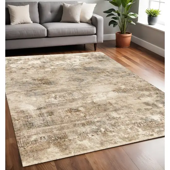 Cream Gray And Tan Abstract Area Rug Photo 1
