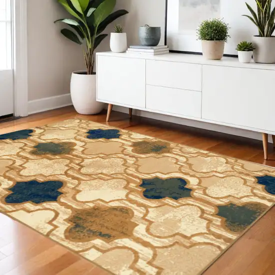 Cream Brown And Teal Quatrefoil Distressed Area Rug Photo 1