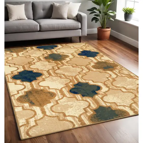 Cream Brown And Teal Quatrefoil Distressed Area Rug Photo 1
