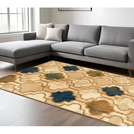 Cream Brown And Teal Quatrefoil Distressed Area Rug Photo 1
