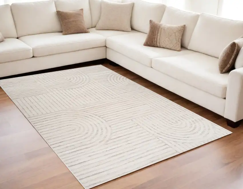 Cream and Beige Abstract Area Rug Photo 1