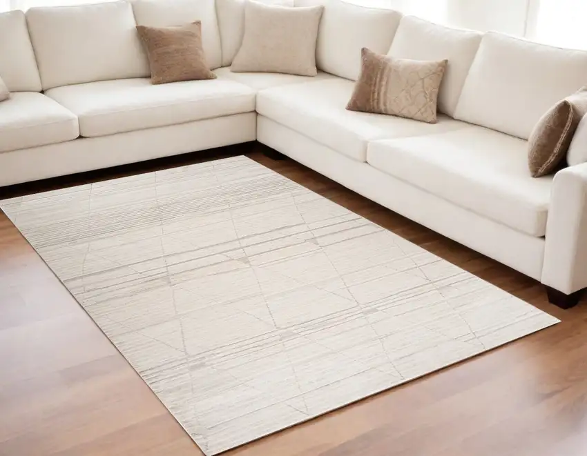 Cream and Beige Abstract Area Rug Photo 1