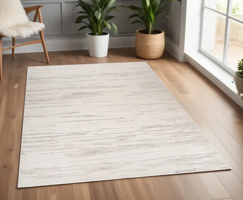 Cream and Beige Abstract Area Rug Photo 1