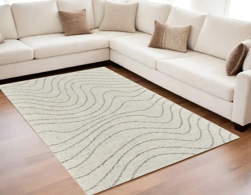 Cream and Beige Abstract Area Rug Photo 1