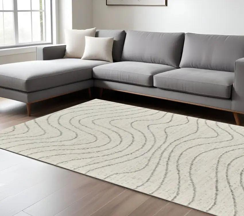 Cream and Beige Abstract Area Rug Photo 1