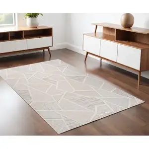 Photo of Cream and Beige Geometric Distressed Area Rug