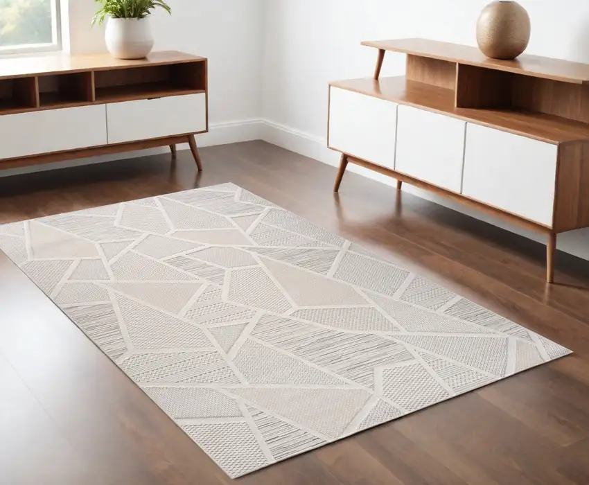 Cream and Beige Geometric Distressed Area Rug Photo 1