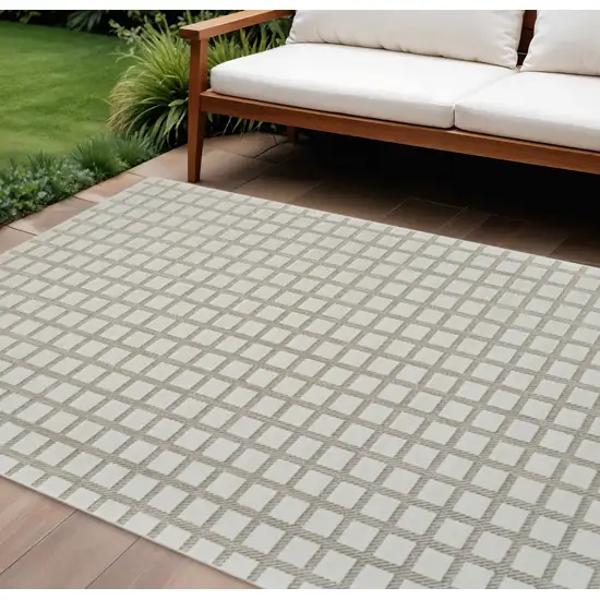 Cream and Beige Geometric Distressed Indoor Outdoor Area Rug Photo 1