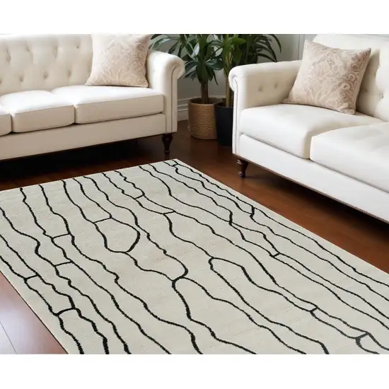 Cream and Black Abstract Distressed Area Rug Photo 2