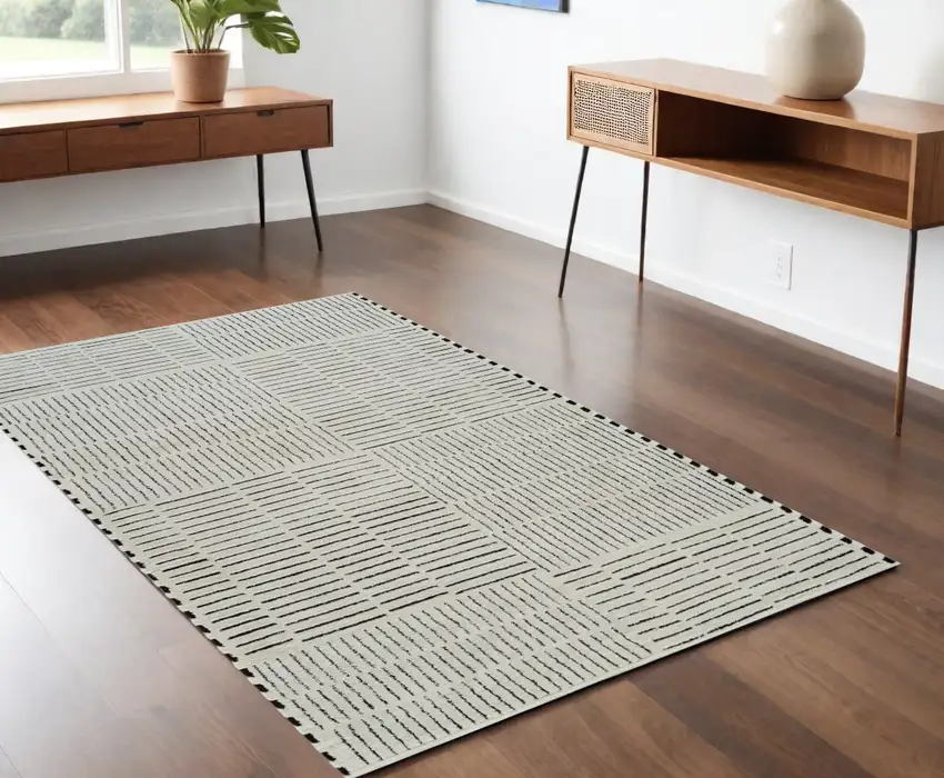 Cream and Black Abstract Distressed Area Rug Photo 1