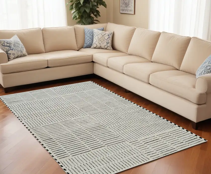 Cream and Black Abstract Distressed Area Rug Photo 1