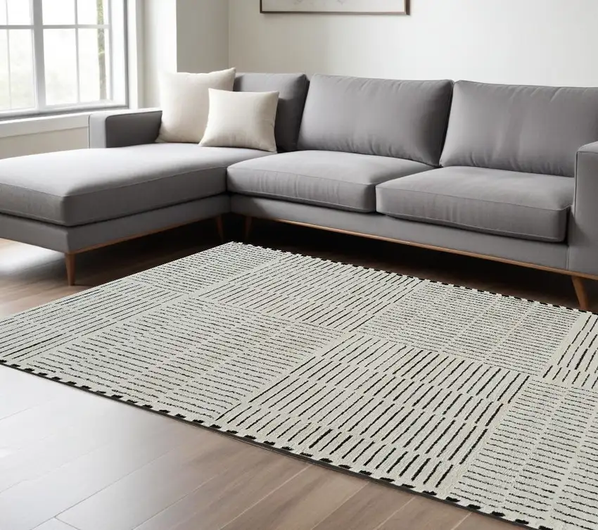 Cream and Black Abstract Distressed Area Rug Photo 1