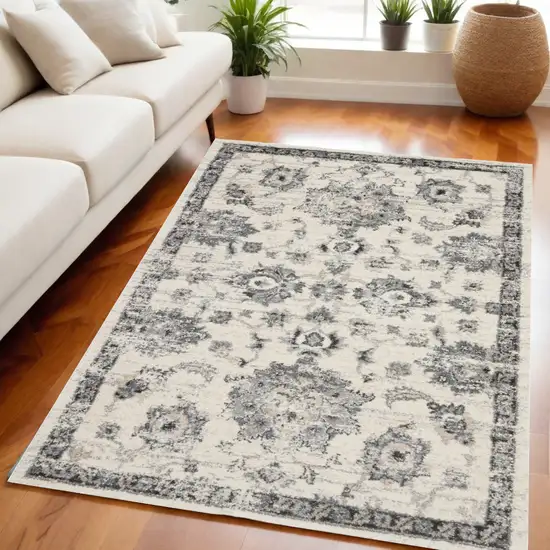 Cream and Gray Floral Distressed Area Rug Photo 1