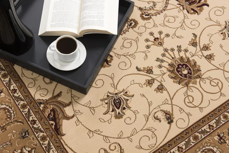Cream and Tan Ornate Border Area Rug Photo 1