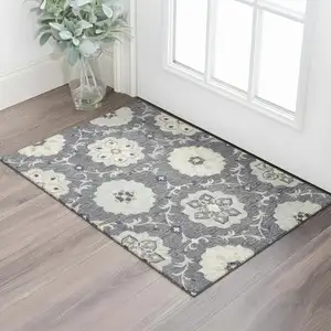 Photo of Dark Gray And Blue Wool Floral Hand Tufted Distressed Area Rug
