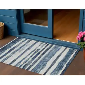 Photo of Denim Blue And Gray Striped Washable Indoor Outdoor Area Rug