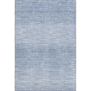 Photo of Denim Blue And Ivory Abstract Washable Area Rug With UV Protection
