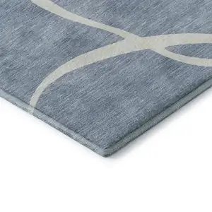 Photo of Denim Blue And Ivory Abstract Washable Area Rug With UV Protection