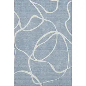 Photo of Denim Blue And Ivory Abstract Washable Area Rug With UV Protection